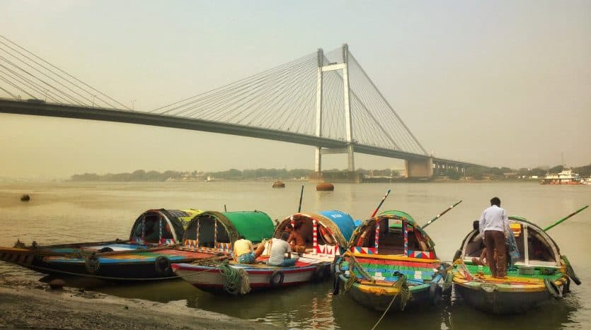 Hooghly Hues - Boats on the Hoogly river in Kolkata against the back drop of the majestic Vidyasagar